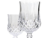 Empty vine glasses isolated on white background