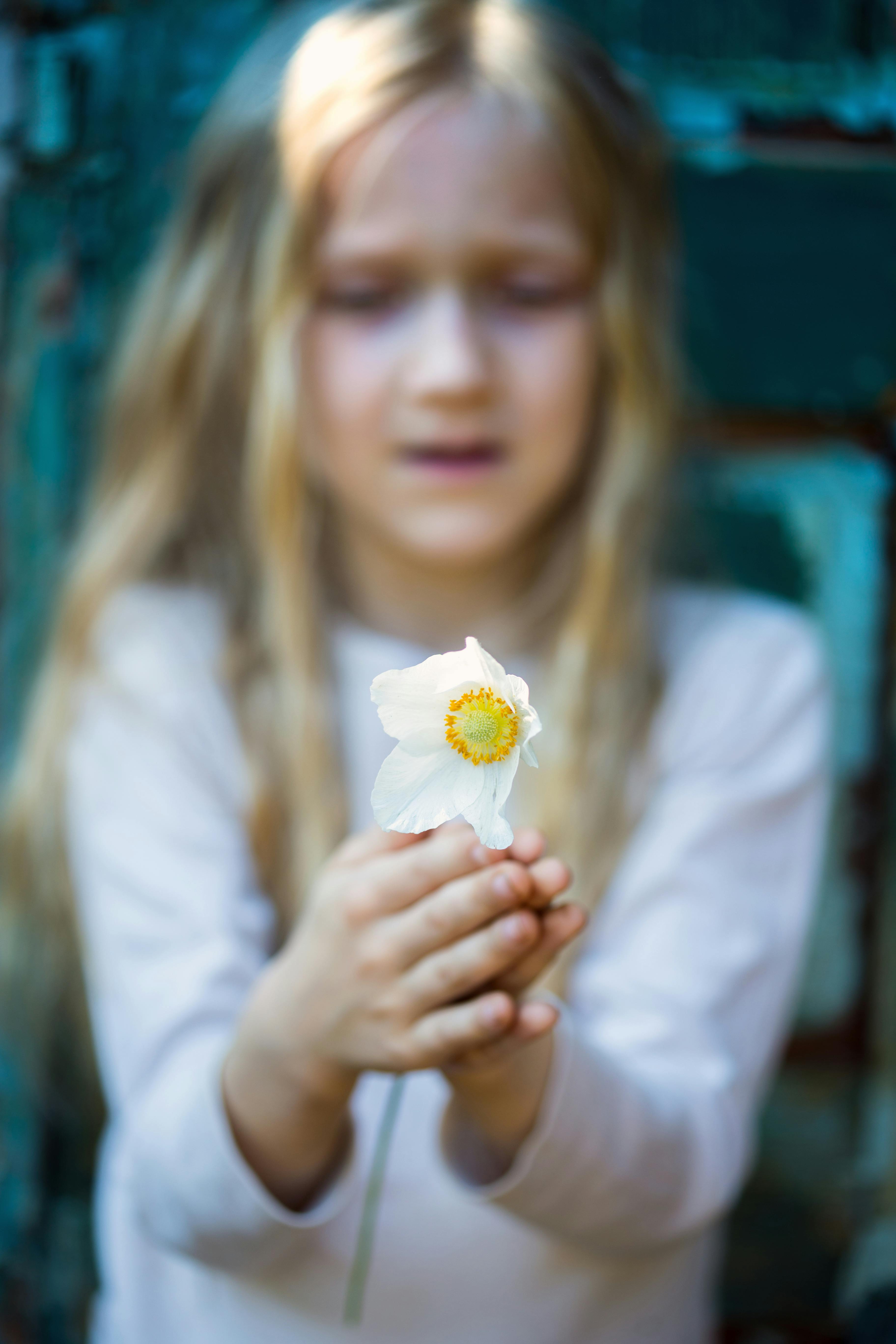 portrait girl holding a flower anemone, vintage,