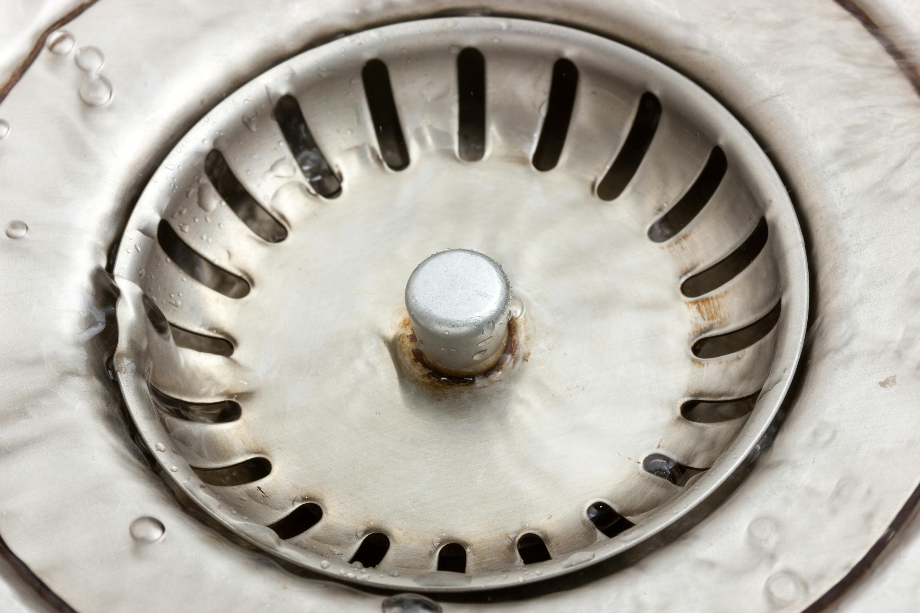 	Close-up of metal sink with flowing water