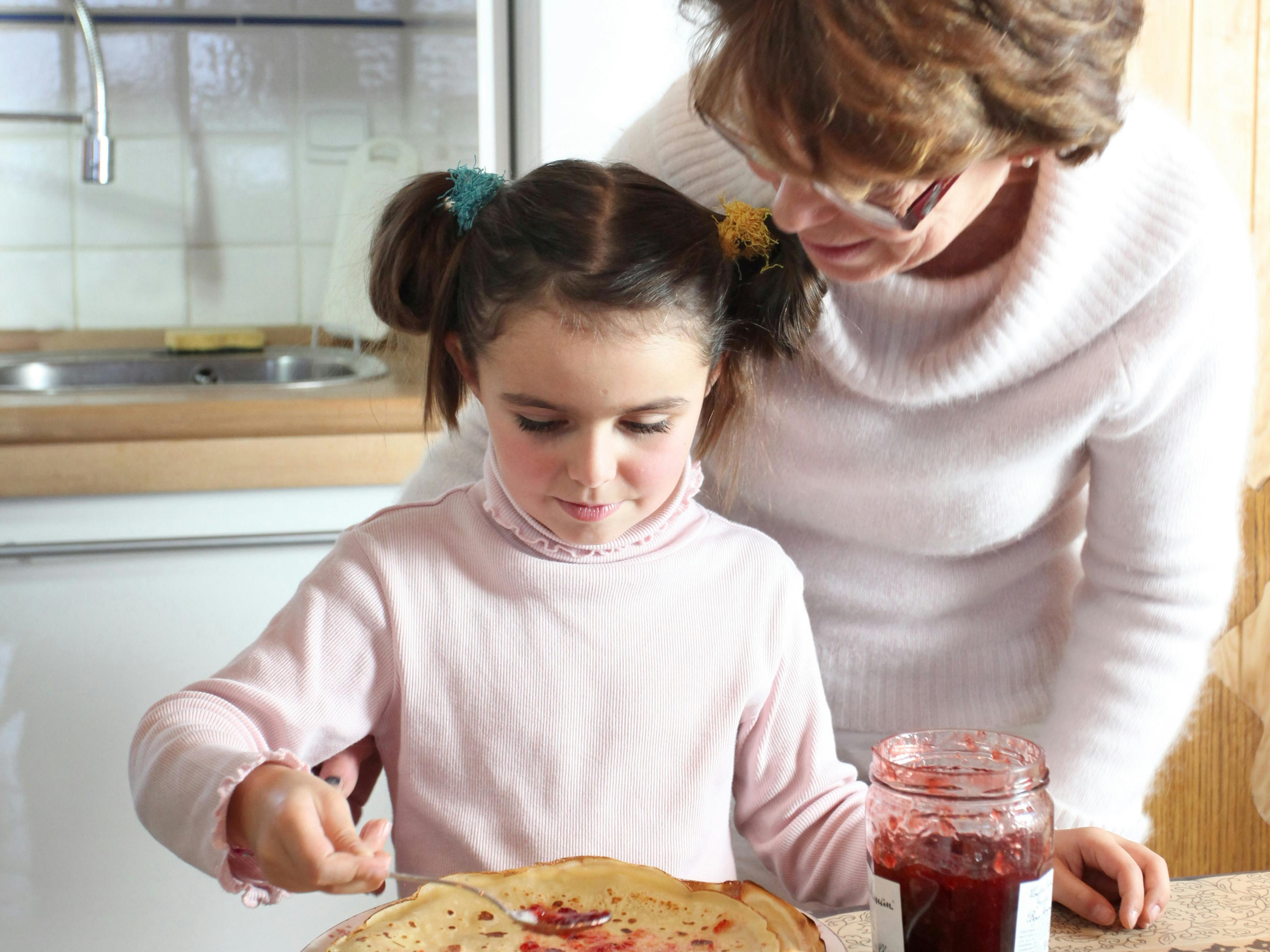 Woman and child making pancakes
