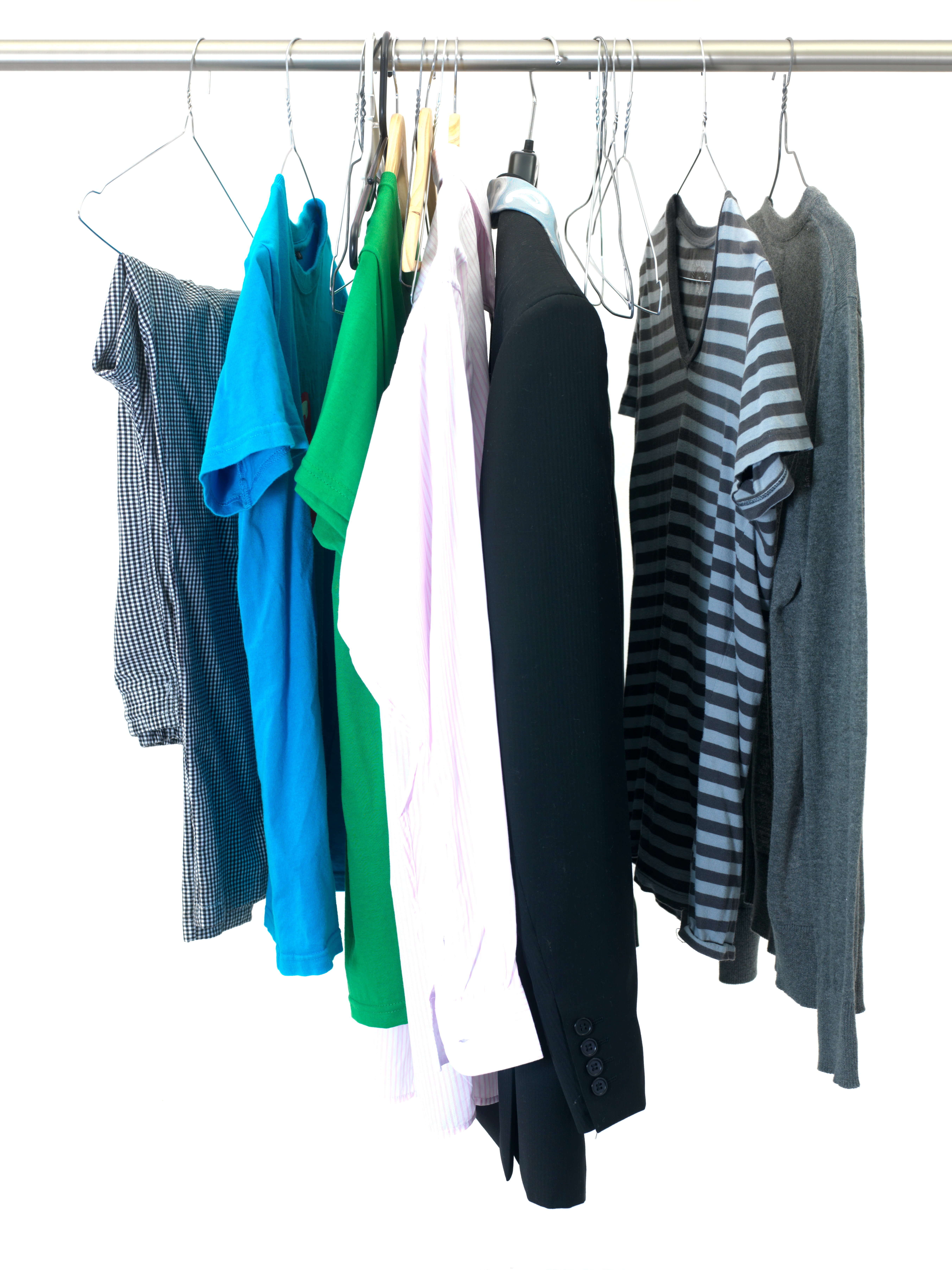 Garments hanging on coat hanger isolated against a white background