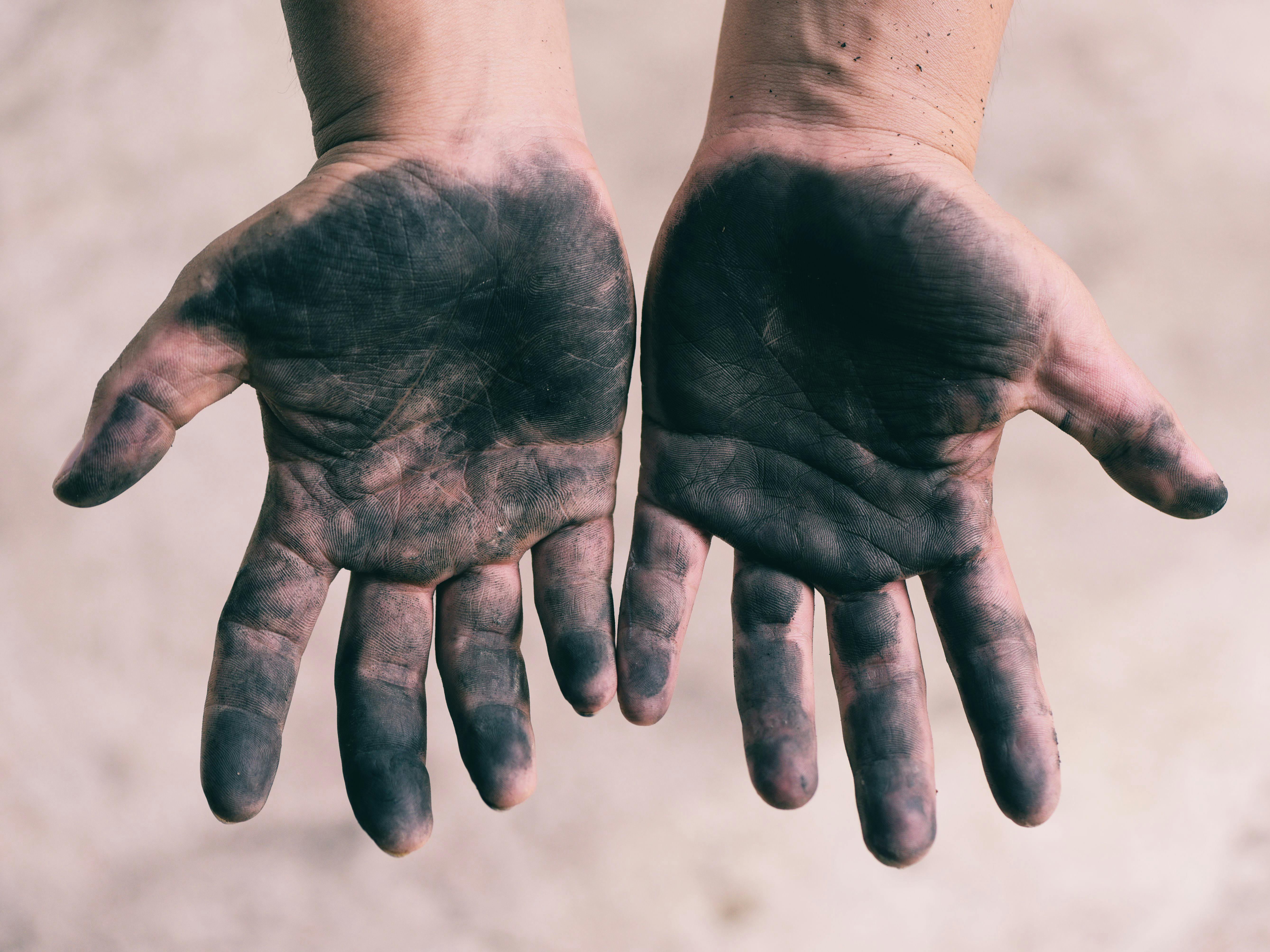 Dirty hands worker hands man / Open hands stained 