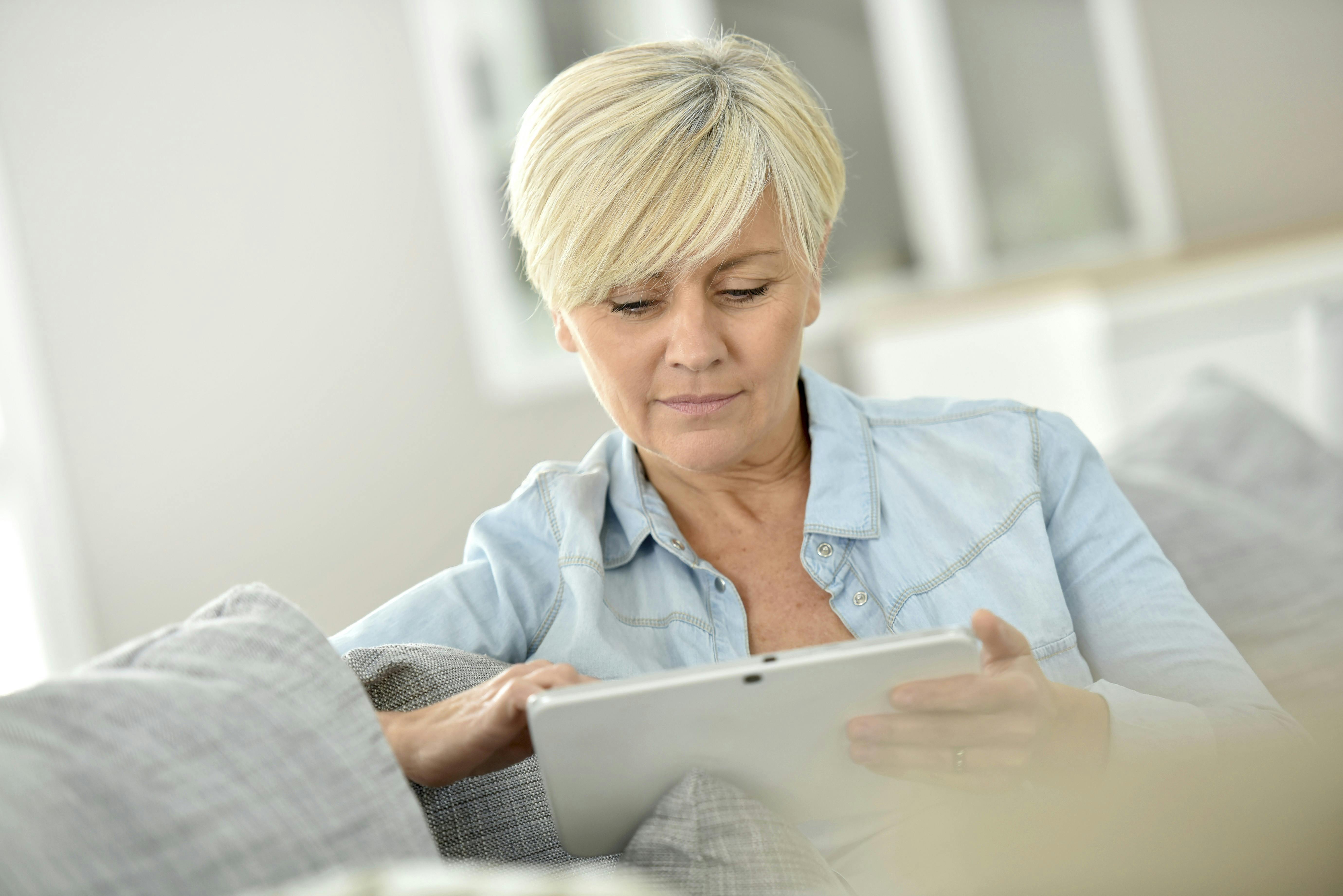 Senior woman websurfing on digital tablet