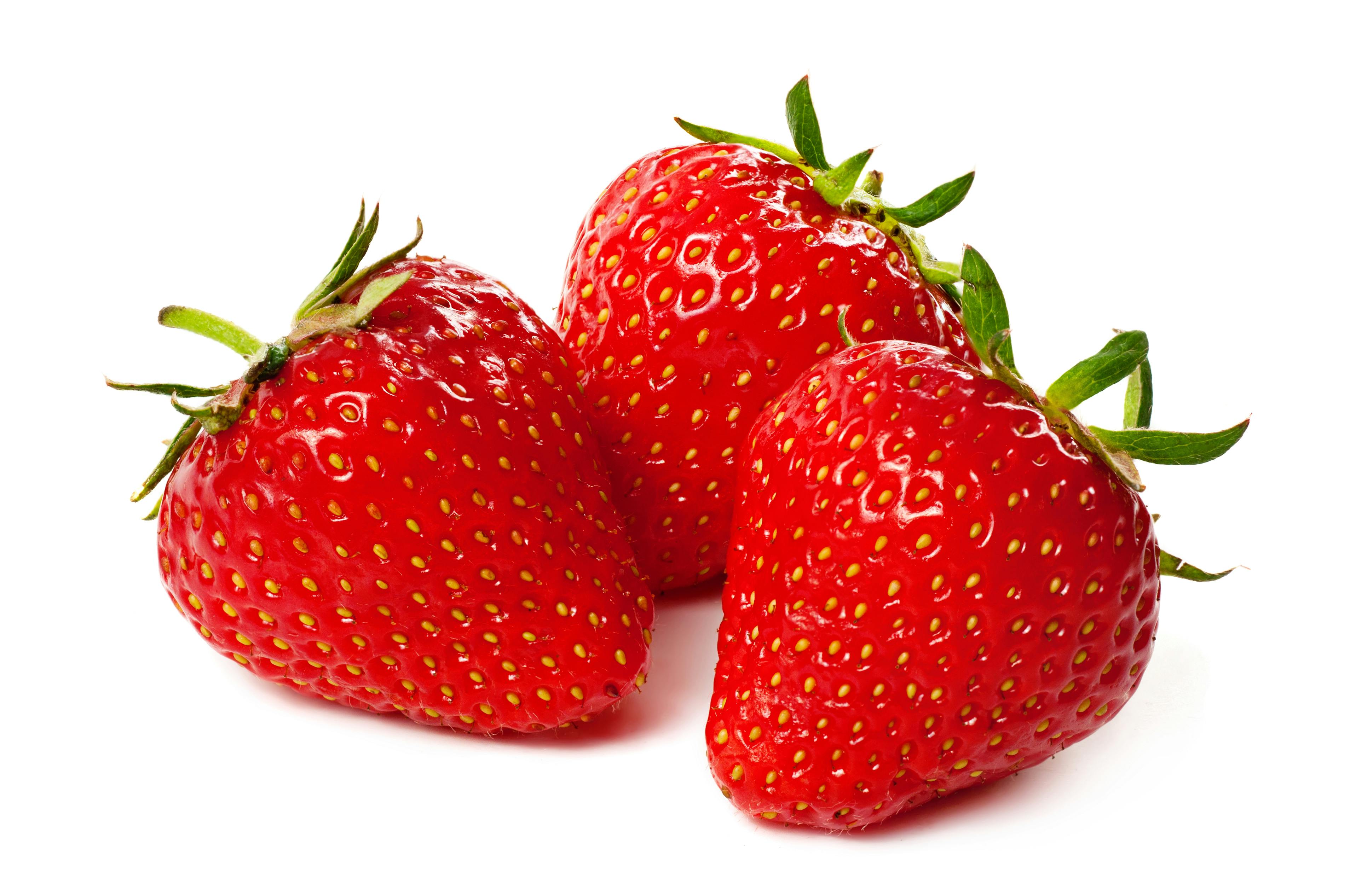 Three strawberry isolated on a white background, macro image