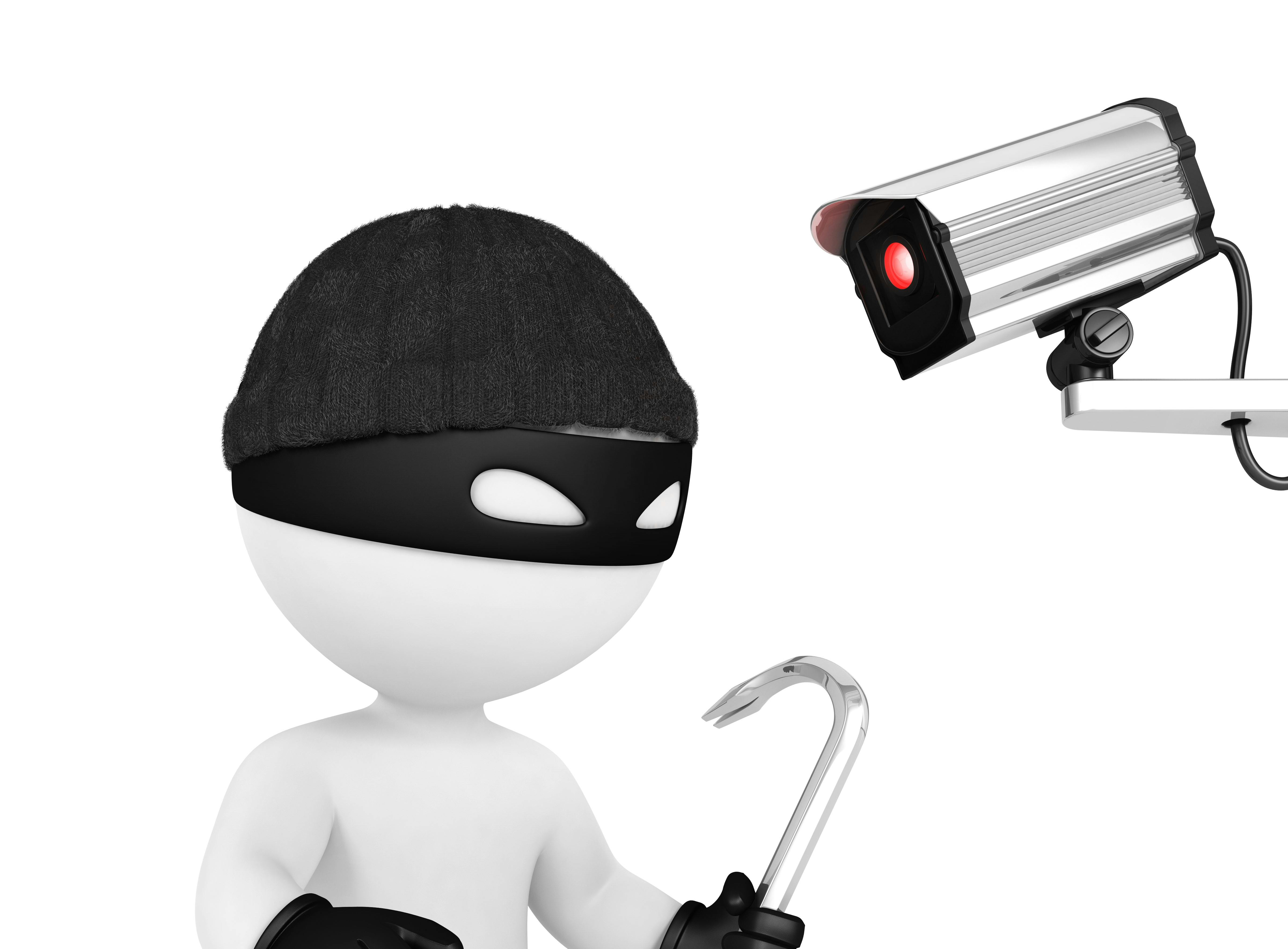 Figur af indbrudstyv med maske og brækjern bliver fanget af et overvågningskamera.