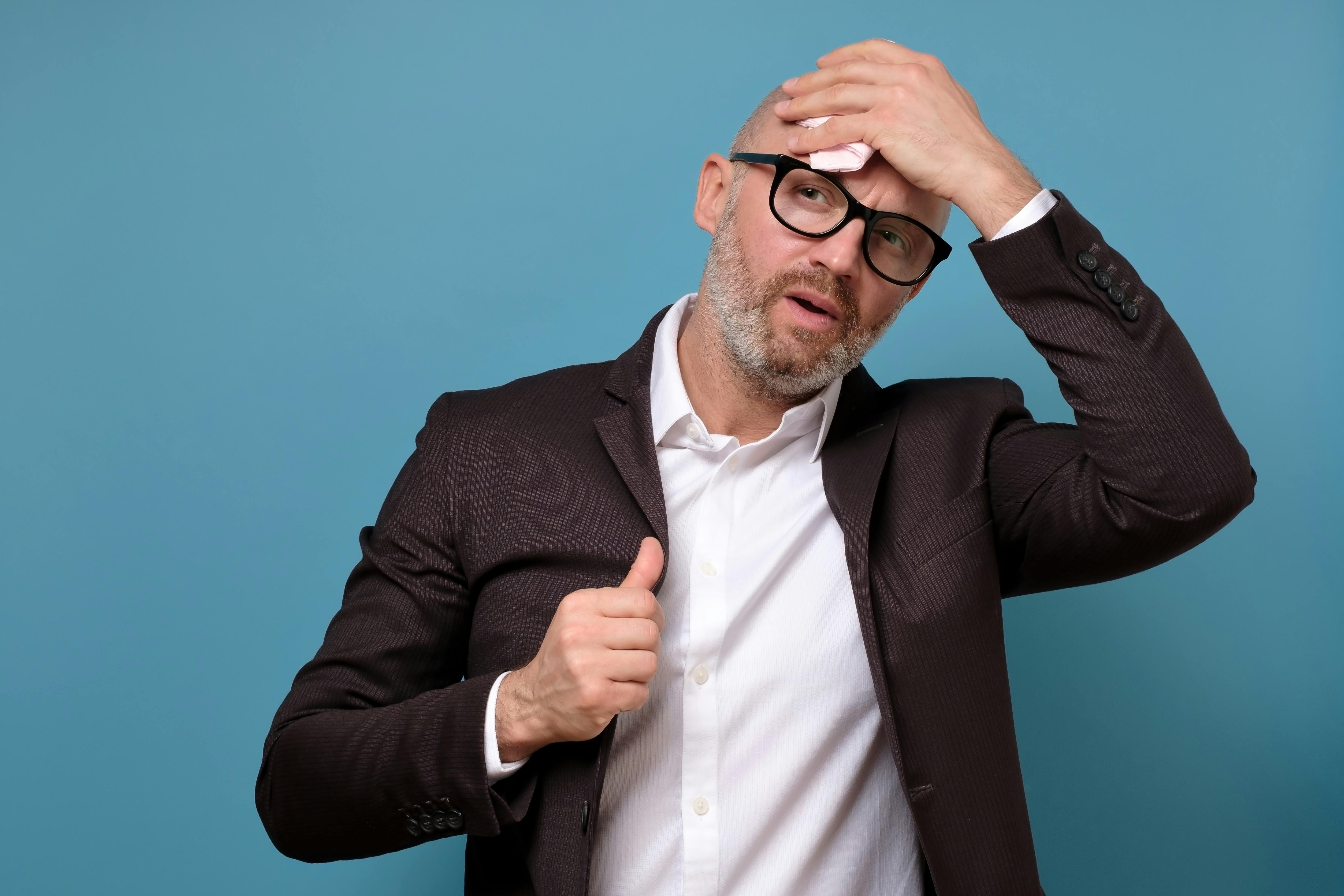 Voldsomme svedeture: Svedig forretningsmand